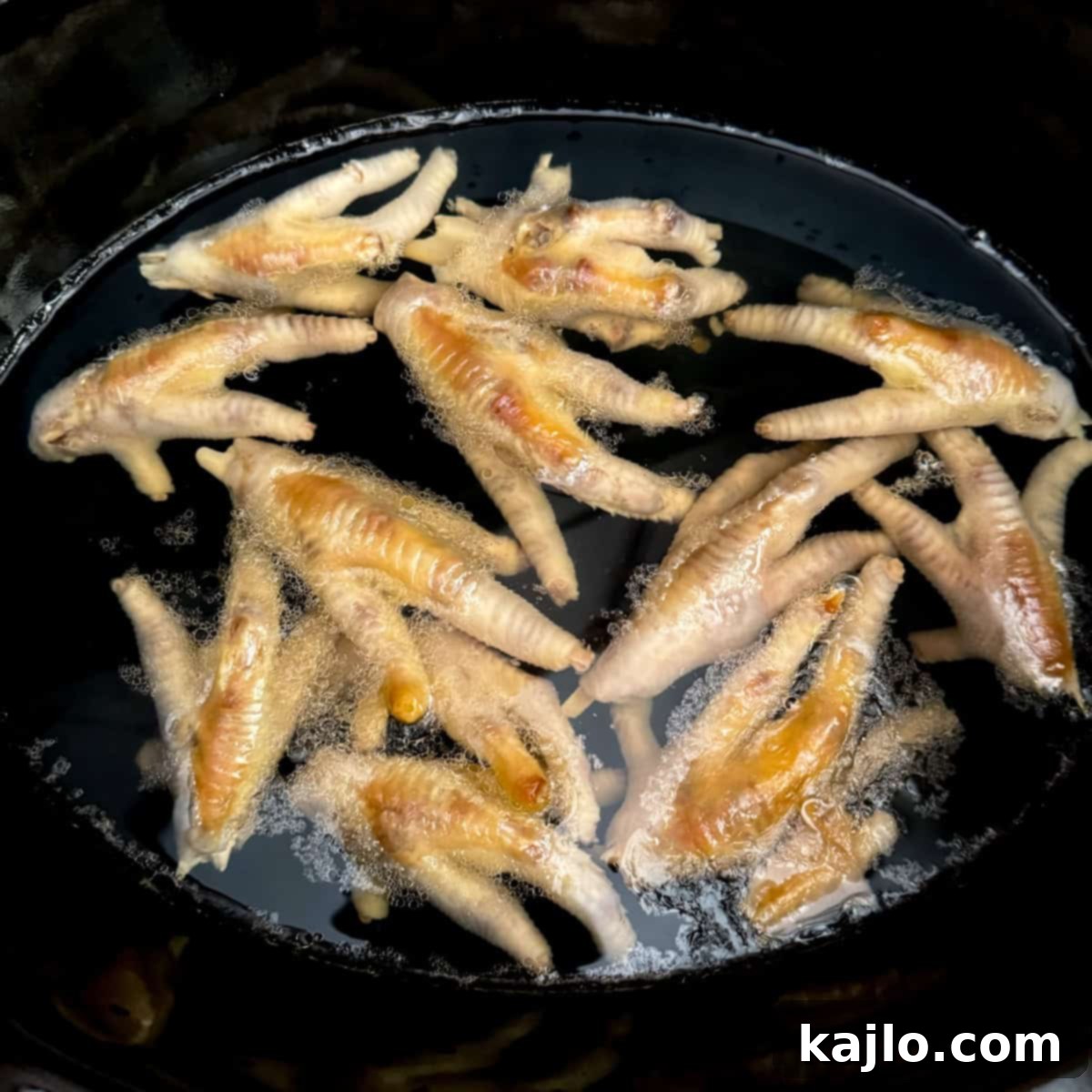 Chicken feet broth cooking in a slow cooker