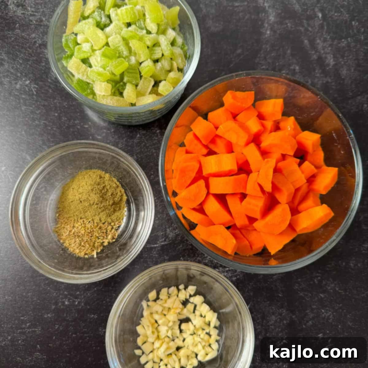 Vegetables and herbs added to chicken feet soup