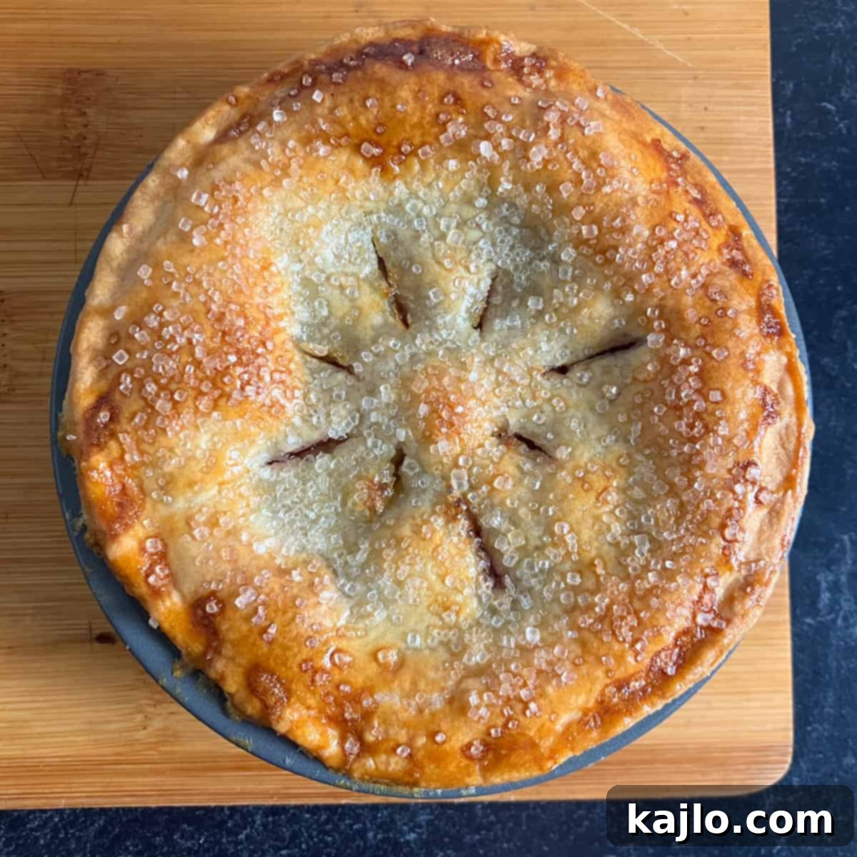 Air Fryer Mini Cherry Pies 7 A frozen cherry pie placed inside an air fryer basket, ready for cooking.