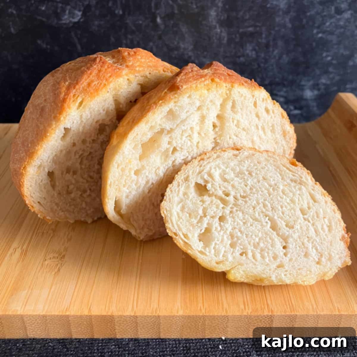 Air Fryer Bread Made Easy 2 Freshly baked bread in an air fryer, ready to be sliced.