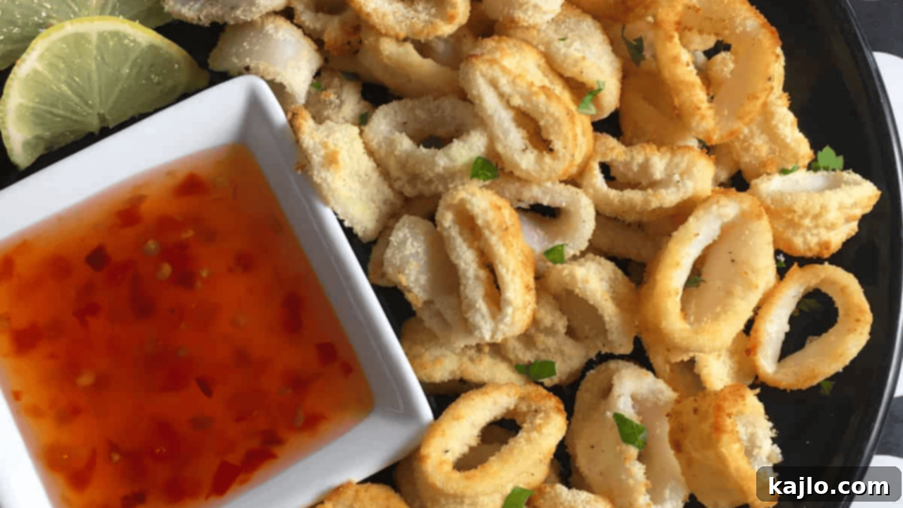 Tender, unbreaded air fryer calamari rings served with a light dipping sauce