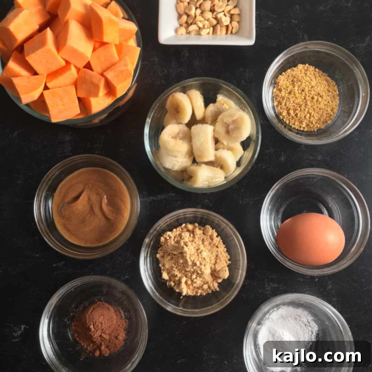 High Protein Air Fryer Muffins for Mass Gain 4 Chocolate peanut butter muffin ingredients spread out on a counter, ready for mixing