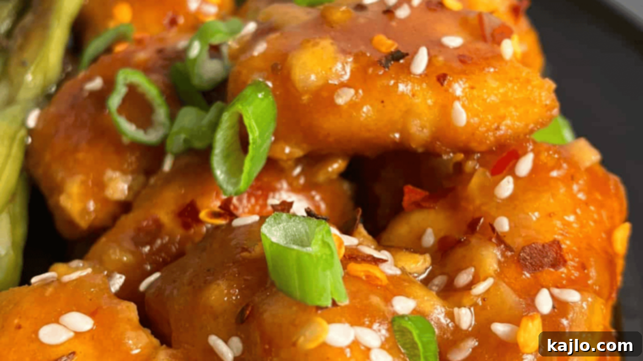 keto orange chicken, tender chicken bites coated in a zesty, tangy orange sauce made with sugar-free marmalade, ideal for a low-carb diet
