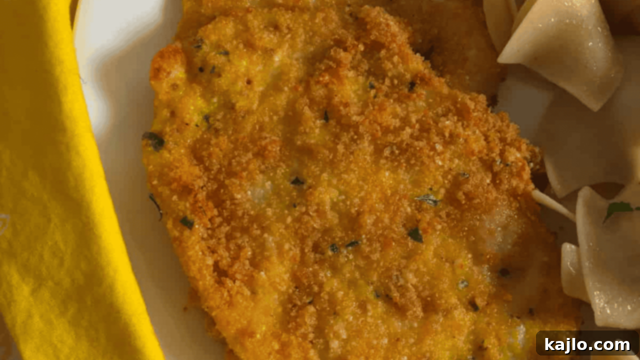Air Fryer Chicken Schnitzel, featuring a crispy coating made from crushed pork rinds for a low-carb option