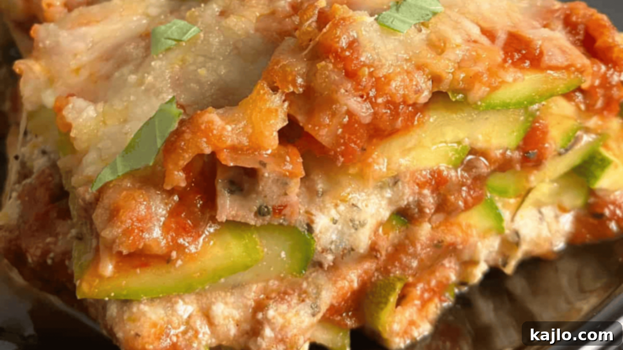 Low Calorie Lasagna, using thinly sliced zucchini to replace traditional pasta sheets for a low-carb alternative