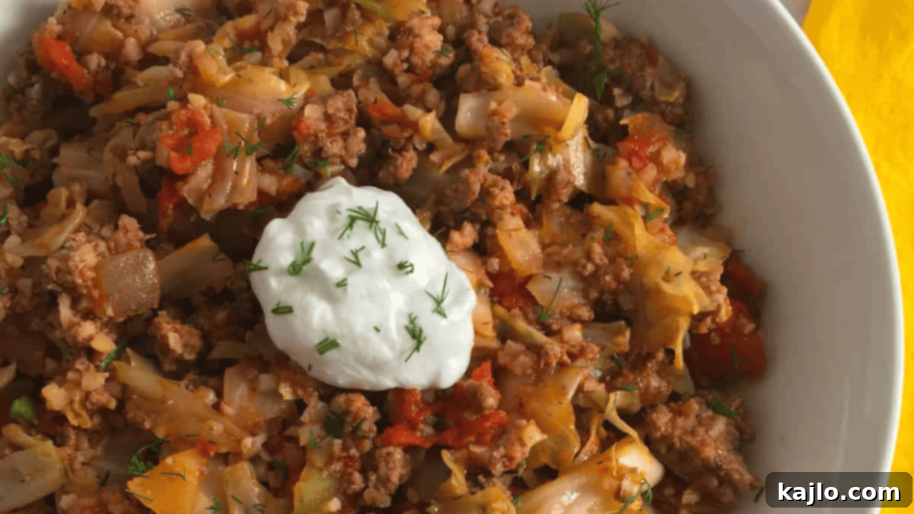 Keto Unrolled Cabbage Rolls, featuring savory seasoned ground beef, tender cabbage, and a rich tomato sauce in a deconstructed bowl format