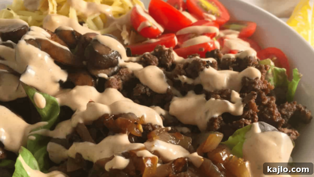 Low Carb Big Mac Bowls, packed with seasoned ground beef, crisp lettuce, tangy cheese, and a creamy, sugar-free special sauce