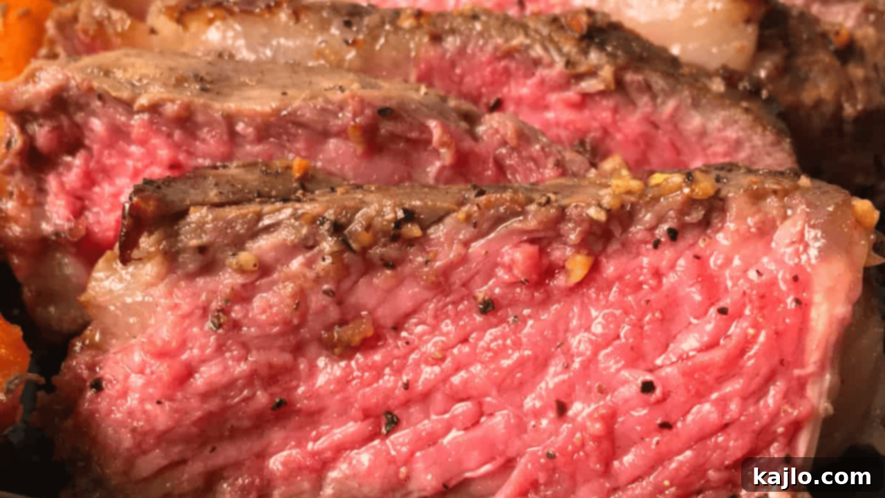 10 Recipes You'll Keep Coming Back For 4 Perfectly cooked air fryer bone-in ribeye steak with a beautiful sear, ready to be enjoyed as a luxurious dinner.