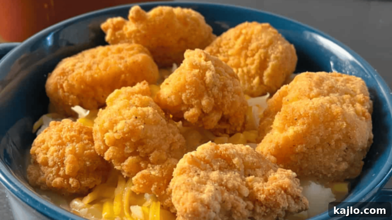 10 Recipes You'll Keep Coming Back For 7 A delicious copycat Famous Bowl featuring crispy popcorn chicken, creamy mashed potatoes, sweet corn, and savory gravy, an indulgent comfort meal.