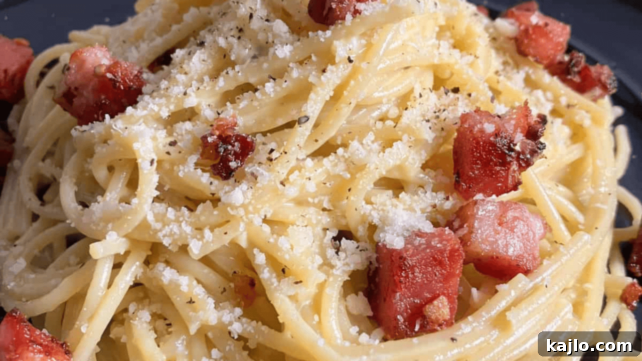 10 Recipes You'll Keep Coming Back For 9 Decadent Pork Belly Pasta featuring crispy pork belly and al dente pasta tossed in a rich, creamy Parmesan sauce, a true culinary indulgence.