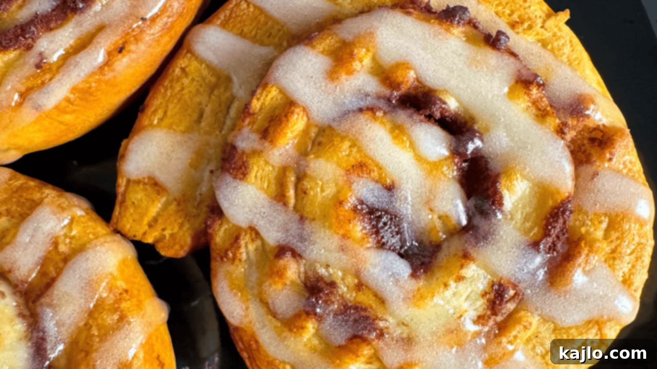 Gooey air-fried cinnamon rolls with sweet icing, a perfect easy breakfast