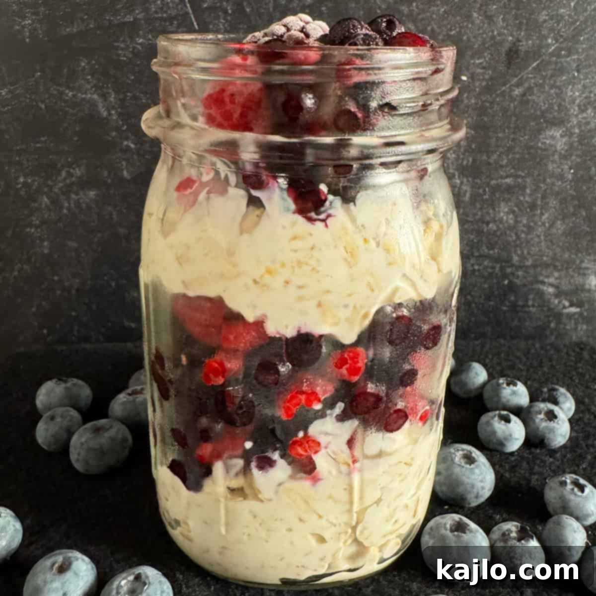 Overnight Oats: Your Favorite Frozen Fruit Creation 2 A beautifully layered jar of overnight oats with mixed frozen berries, ready to be enjoyed as a healthy breakfast.