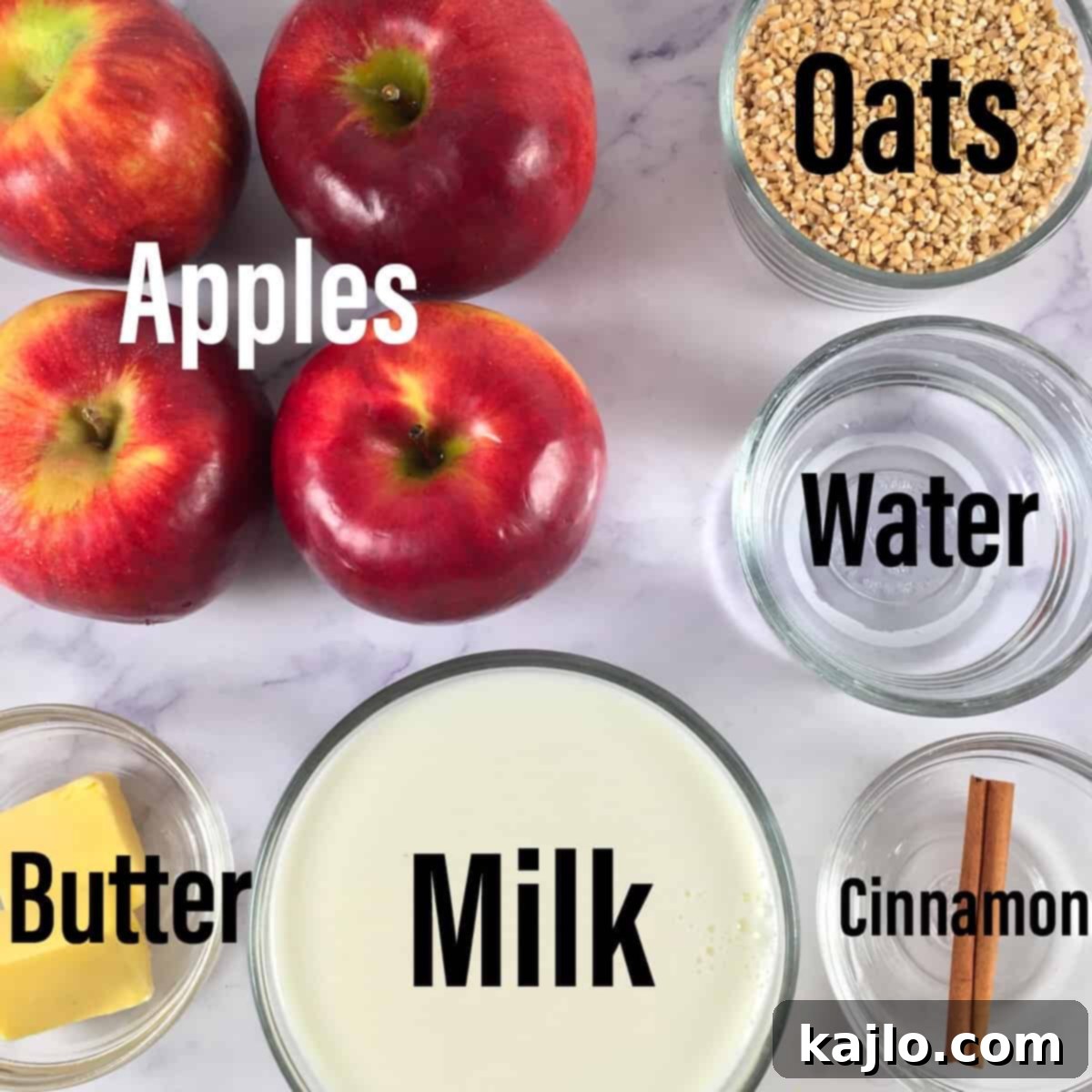 A selection of ingredients for cinnamon apple steel cut oats, including oats, apples, milk, butter, and a cinnamon stick.
