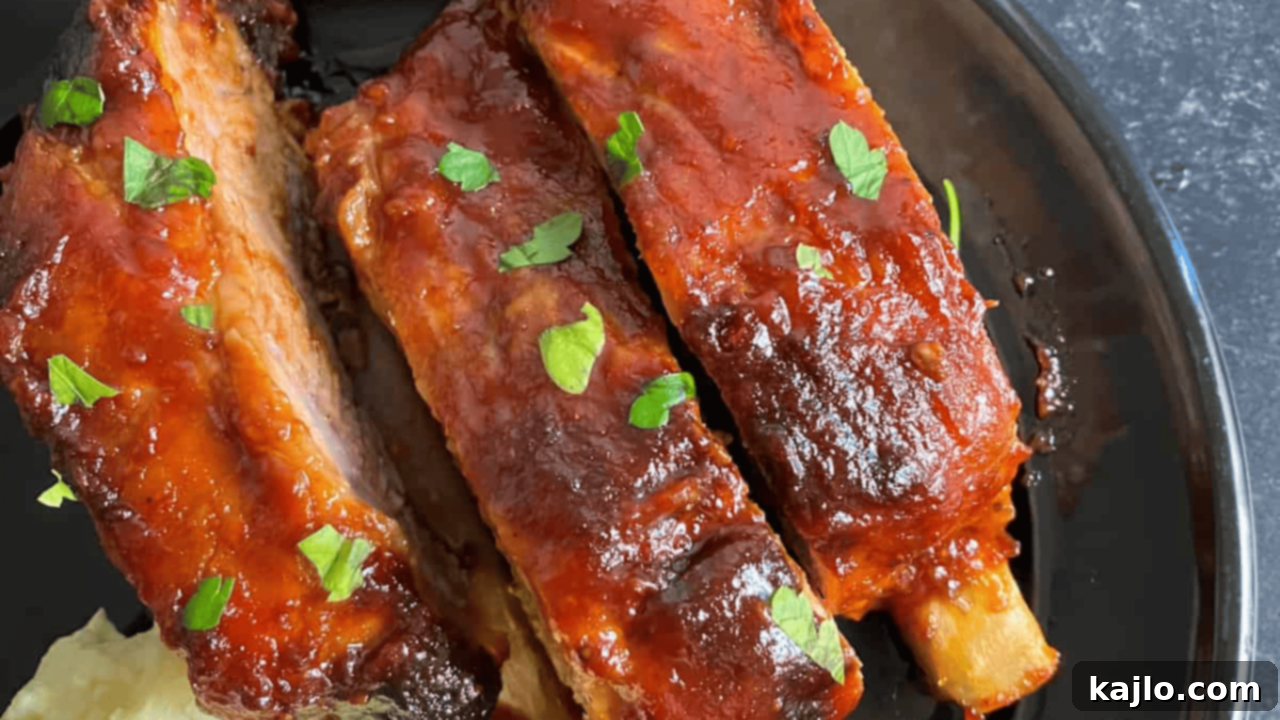 10 Legendary Meat Recipes That Always Impress 5 Perfectly baked St. Louis style ribs in the oven, coated in a glistening, savory glaze.