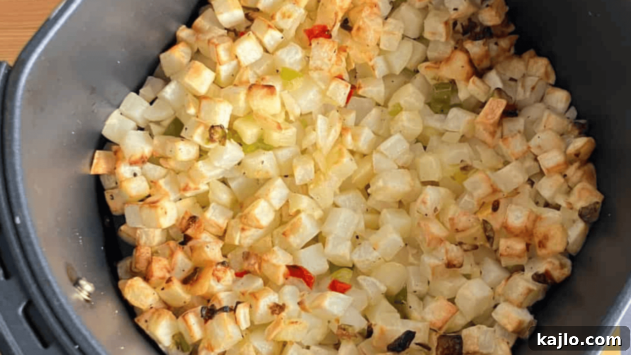 Golden, crispy frozen diced hash browns cooked in an air fryer, perfect for breakfast