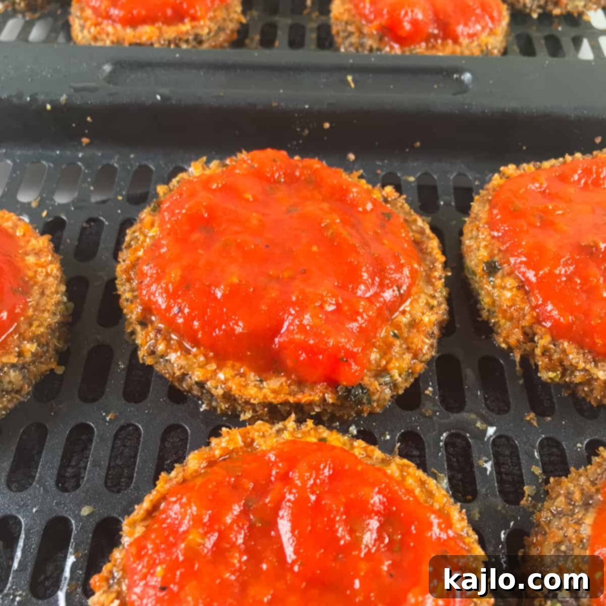 Crispy Air Fryer Eggplant Parmesan 5 marinara sauce on breaded eggplant slices