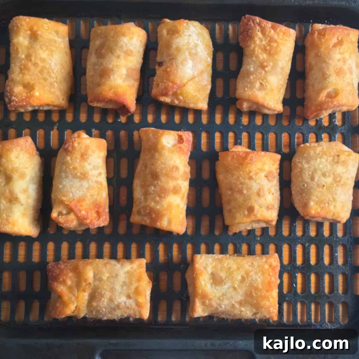 Air frying frozen spring rolls, mid-cook