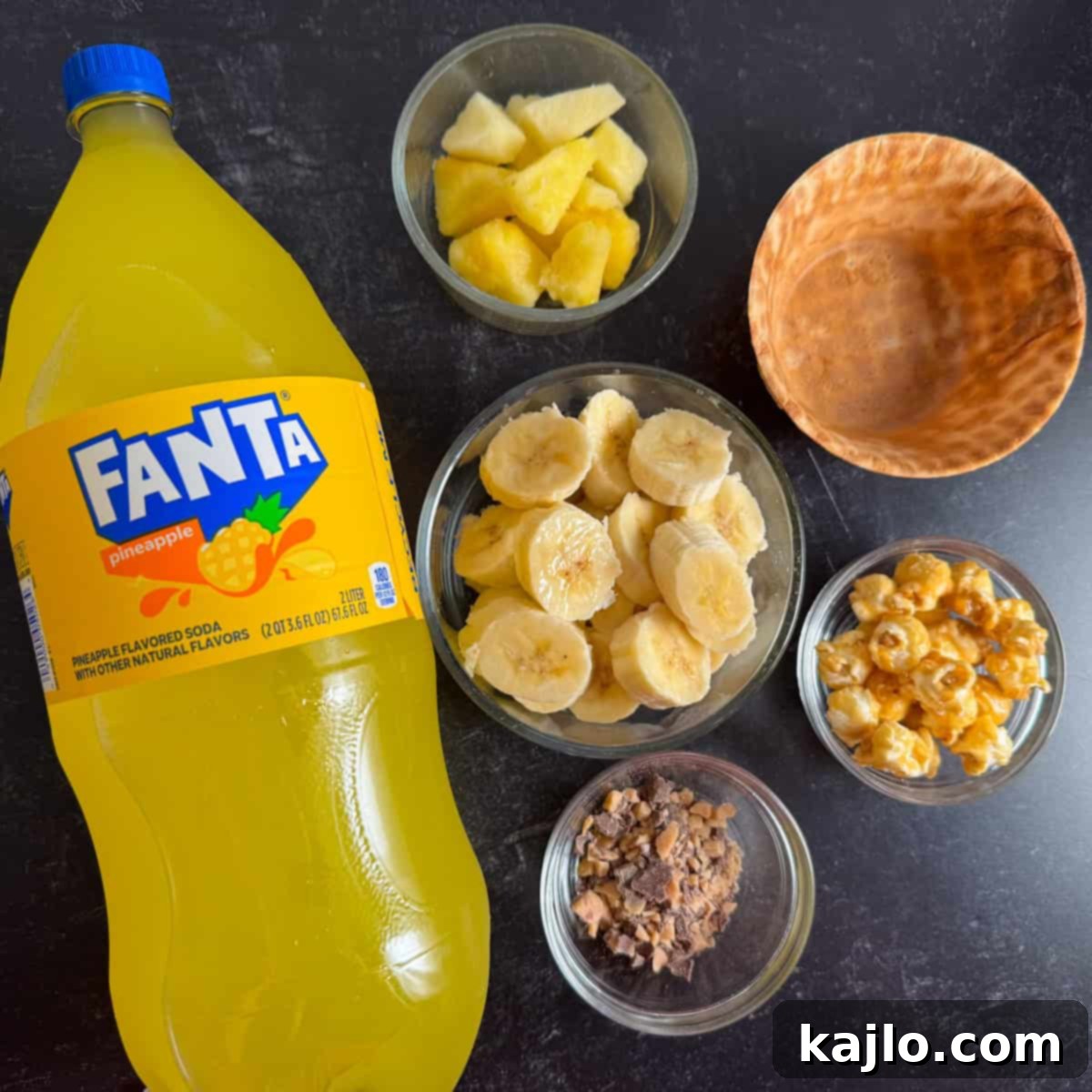 Homemade DK Crush Float 4 DK Crush Float Ingredients, showing bananas, pineapple, Fanta, popcorn, and toffee.