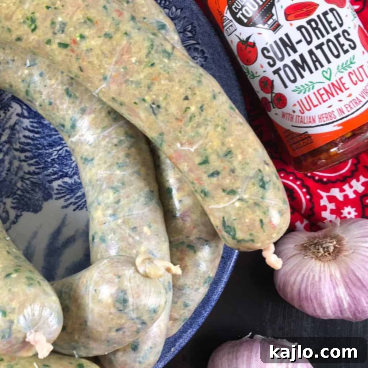 Large batch of freshly made homemade chicken sausage links in a tray