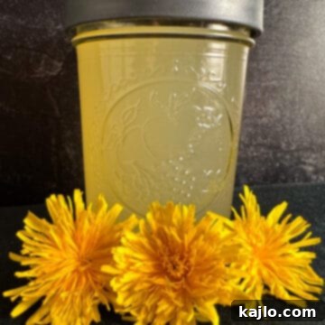Homemade dandelion vinegar recipe in a clear bottle