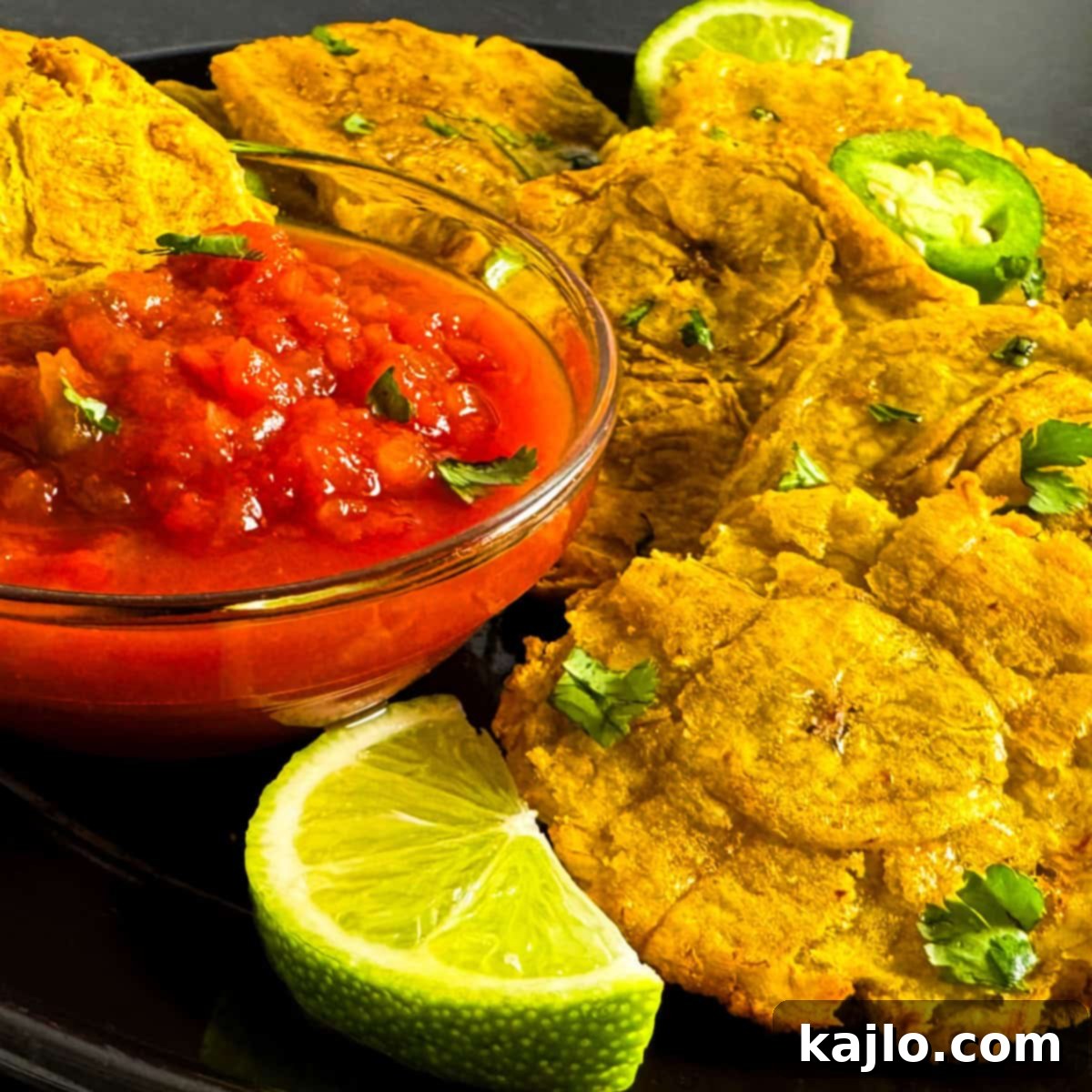 Air Fried Frozen Plantains Sweet Maduros and Savory Tostones 8 Air fried frozen plantains, both sweet and savory, arranged with various dipping sauces and garnishes.