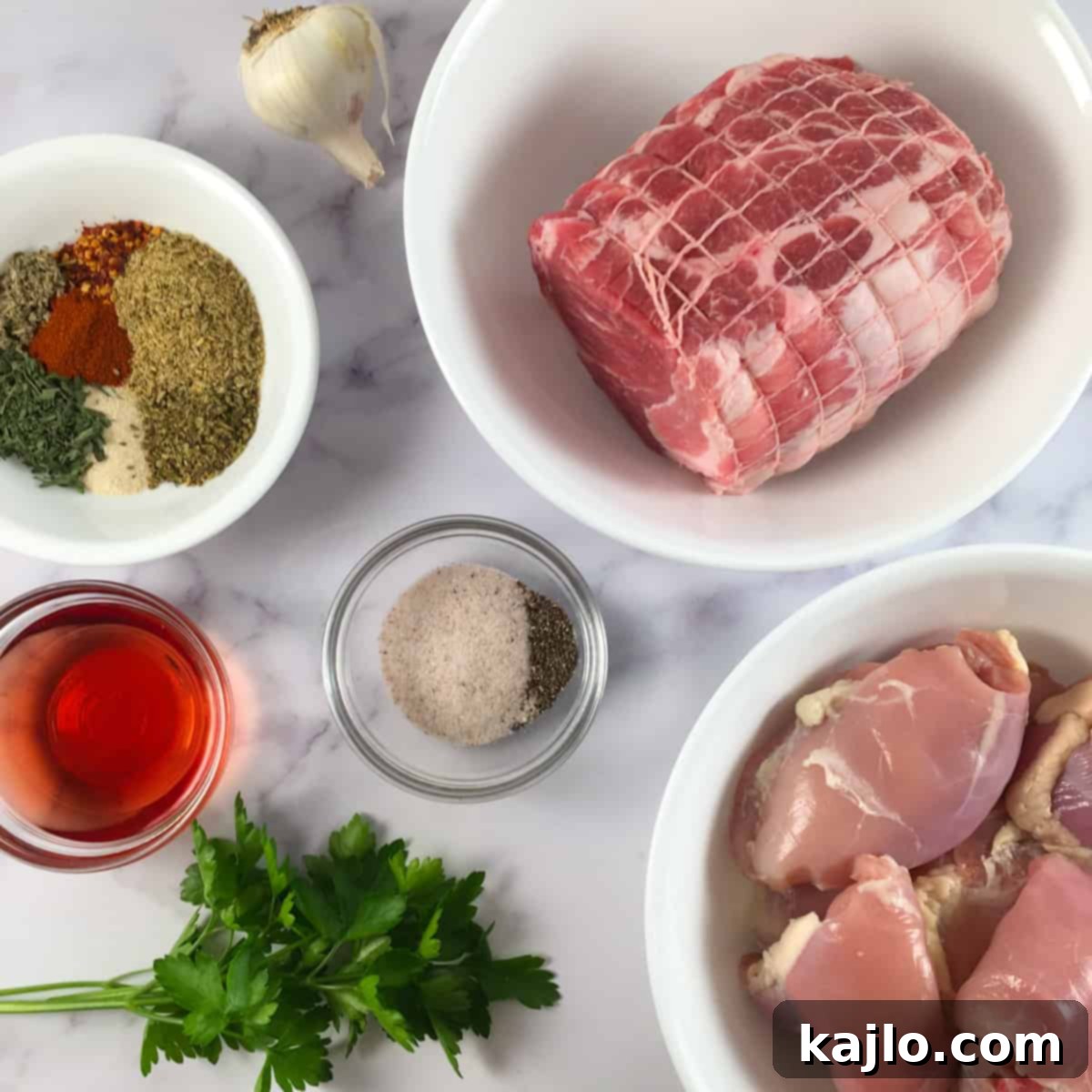 Close-up of fresh ingredients for Italian fennel sausage including pork, chicken, fresh parsley, and garlic.