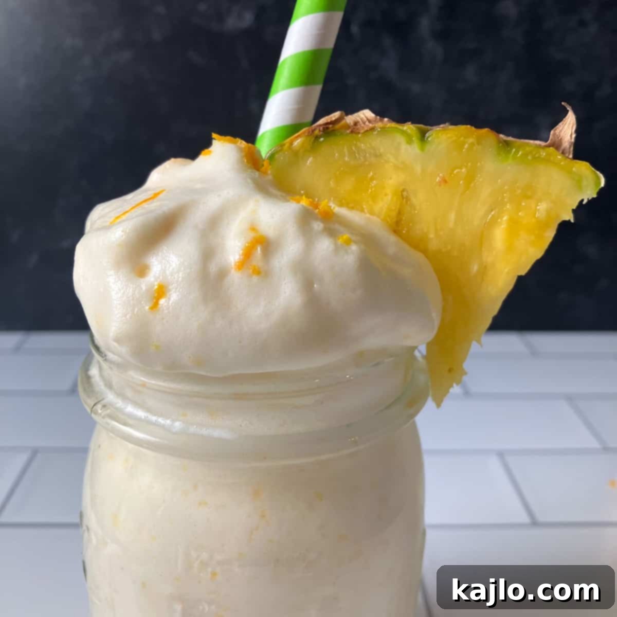 Guilt-Free Peach Pineapple Smoothie 2 Creamy peach pineapple smoothie served in a glass