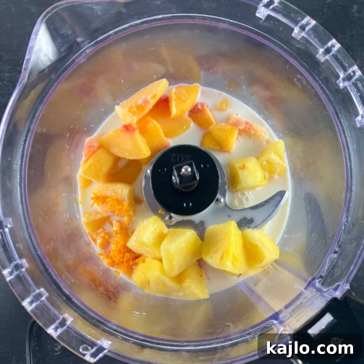 Guilt-Free Peach Pineapple Smoothie 4 Frozen peaches, pineapples, and milk laid out for smoothie preparation