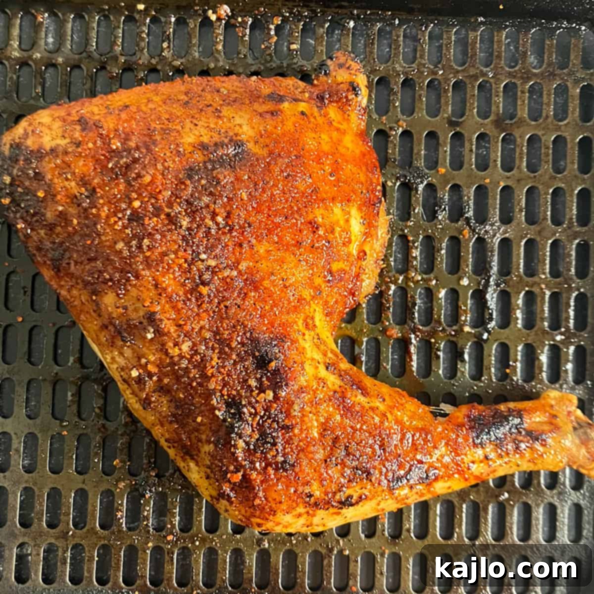 Perfectly seasoned keto chicken leg quarter, ready for air frying
