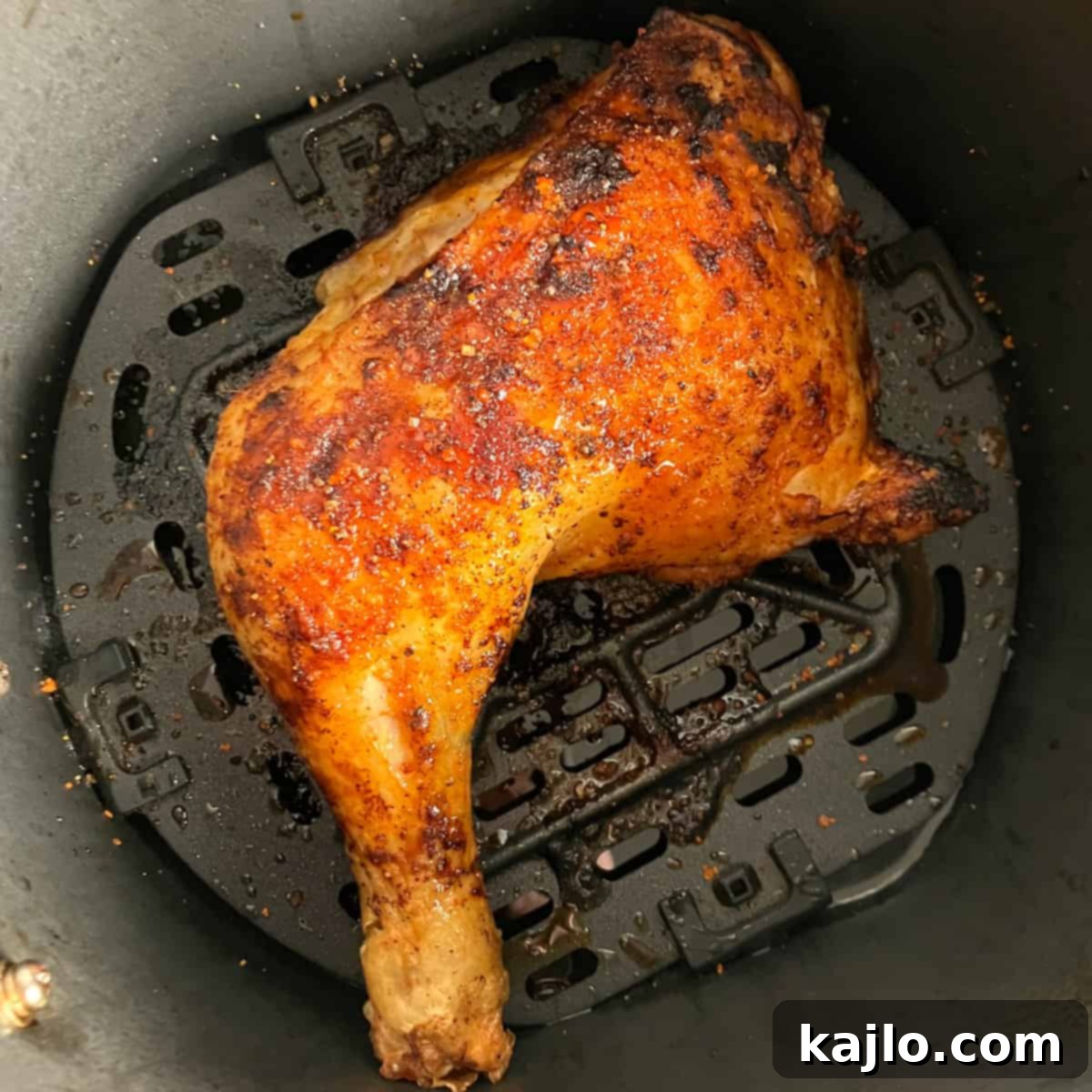 Air frying chicken leg quarter, achieving a golden crisp
