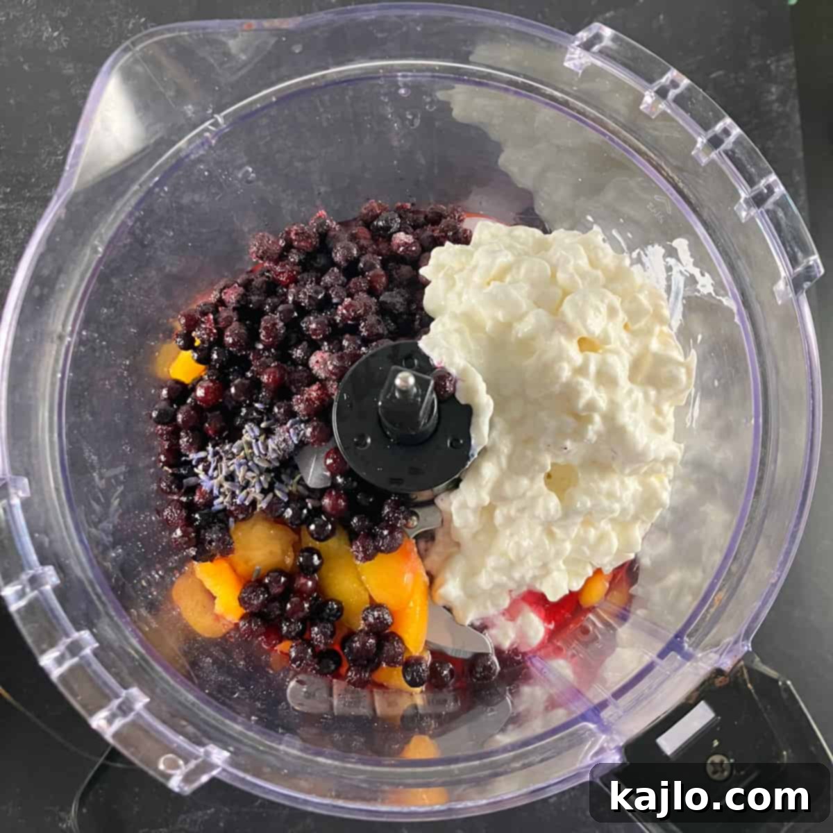 Step-by-step process of making a peach blueberry smoothie