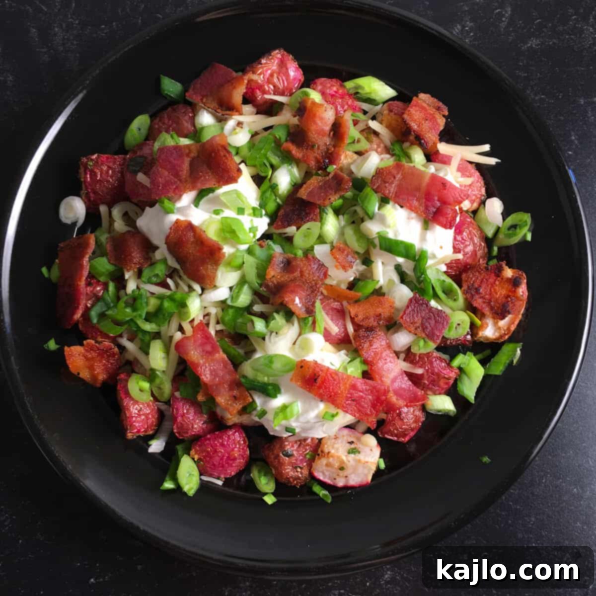 A serving of air fried radishes with melted cheese and fresh herbs, ready to be enjoyed.