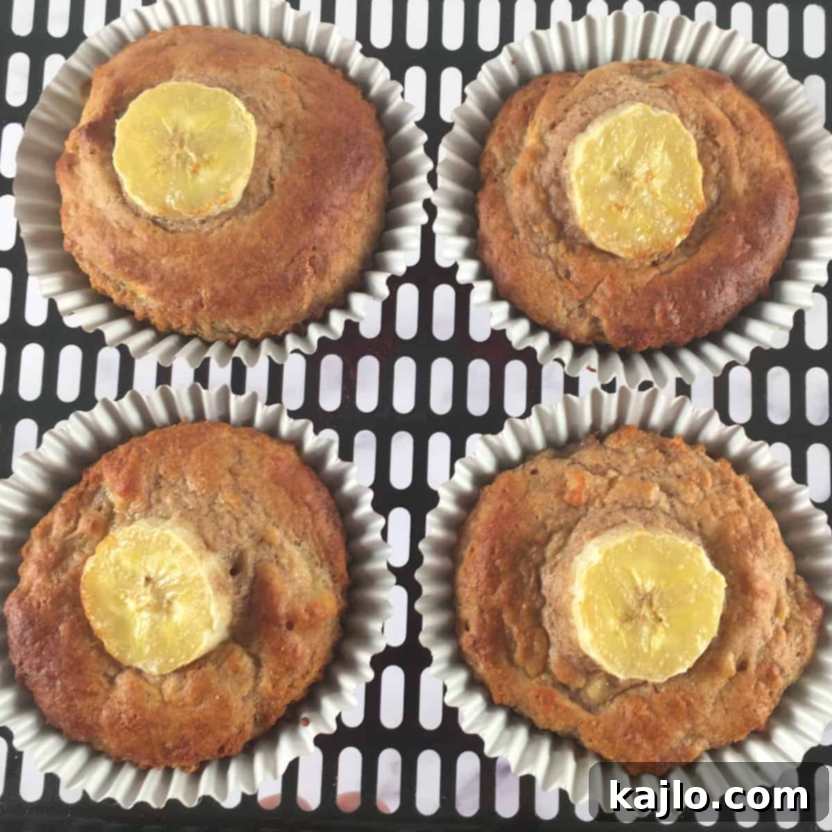 Air fryer banana muffins with fresh banana slices on top before baking