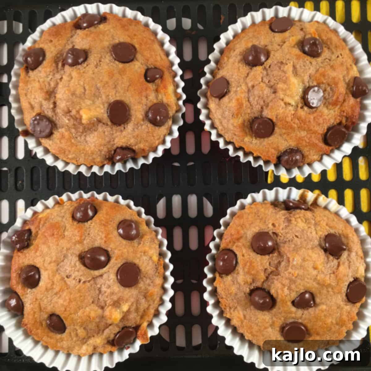 Freshly baked air fryer muffins cooling down on a wire rack