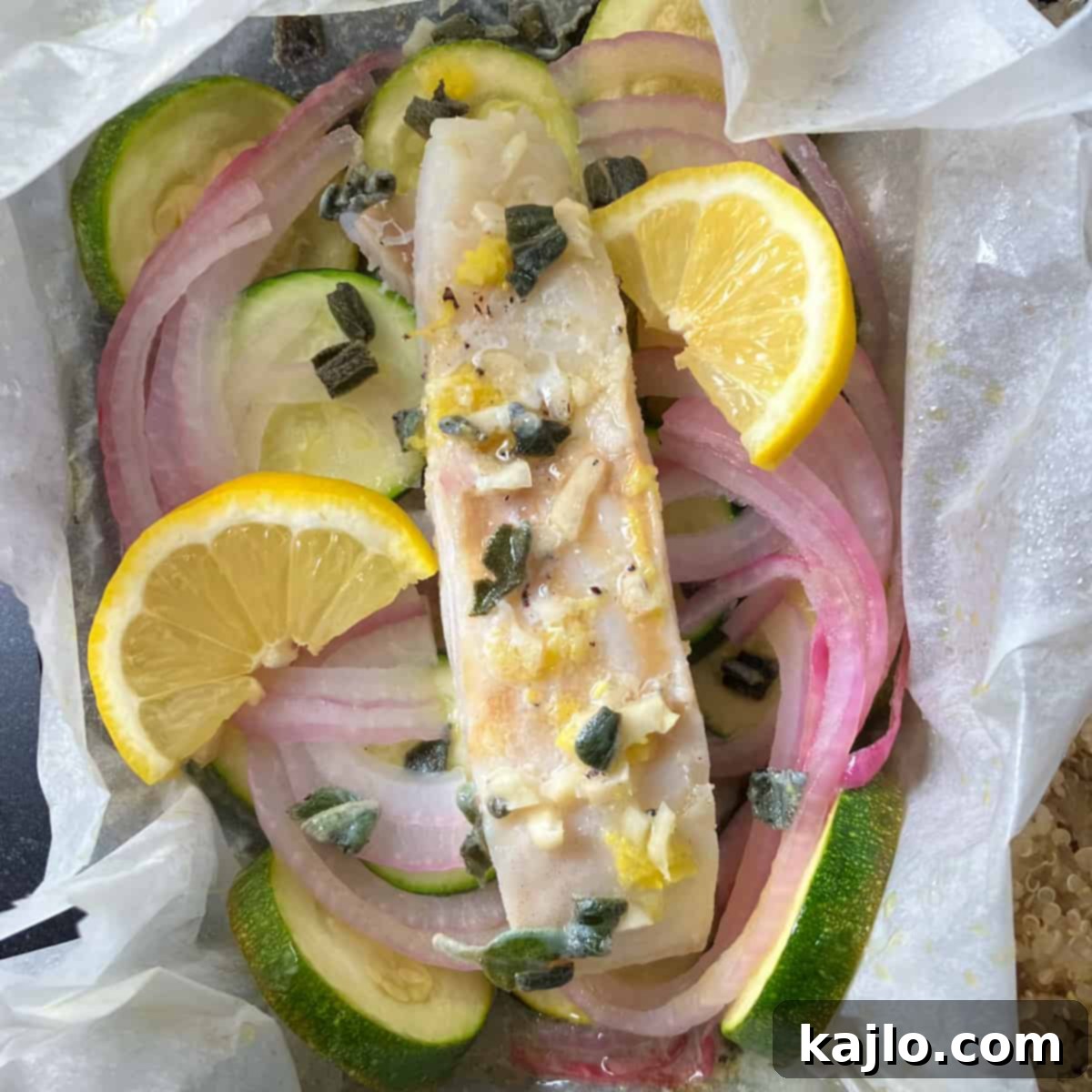 Parchment Baked Cod with Seasonal Vegetables 3 Close-up of cod fillet and vegetables nestled in parchment, ready to be folded and baked.